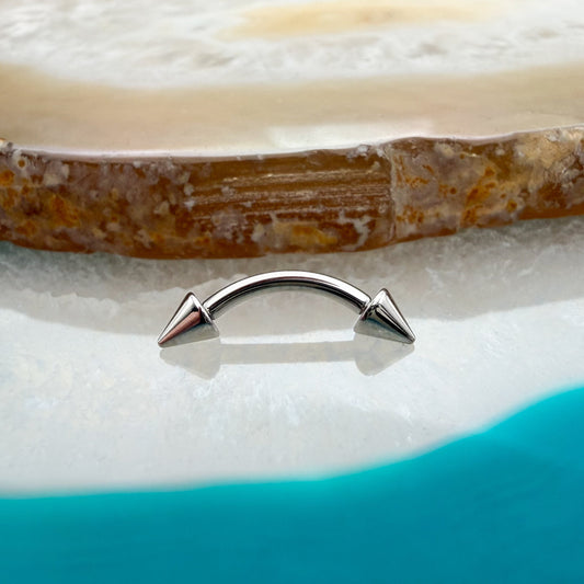 Curved Barbell with Spike Ends