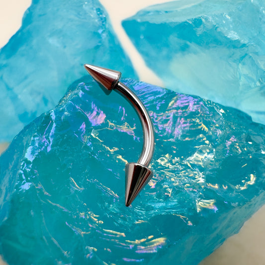 Curved Barbell with Spike Ends